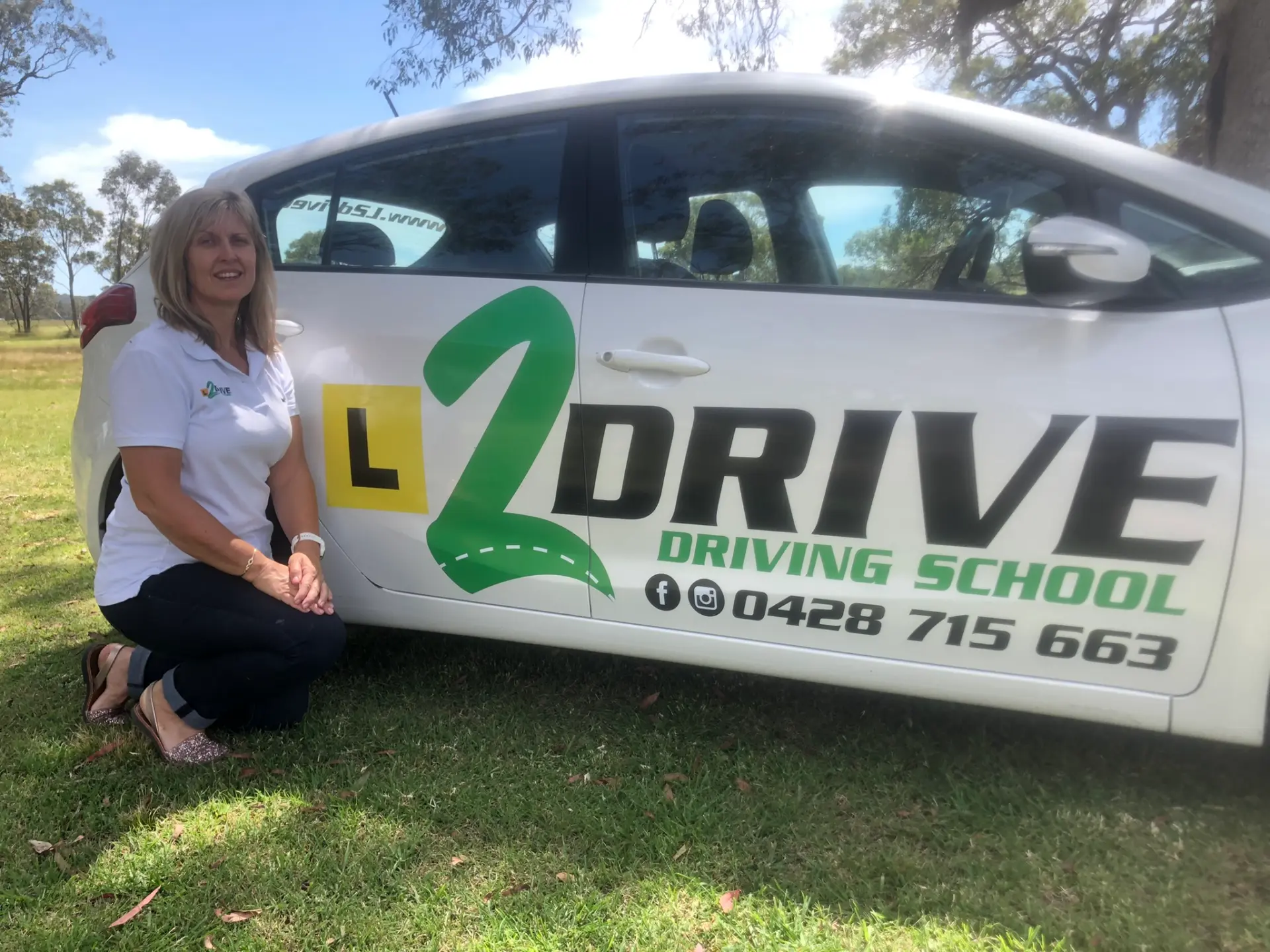 Rebecca, L2Drive Driving School Instructor, With Her Branded Car