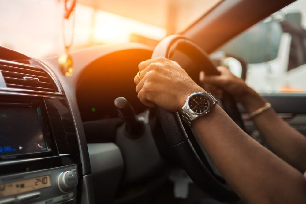 Man Holding Handle Of A Car — L2Drive Driving School in Warwick, QLD