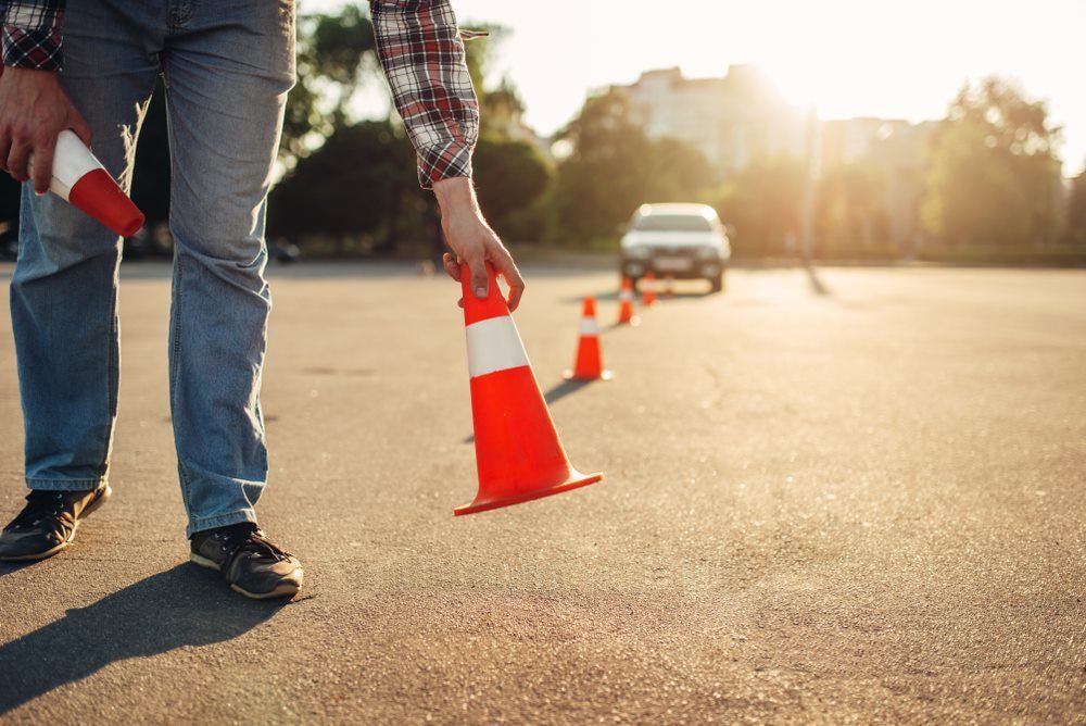 Man Holding Cone — L2Drive Driving School in Warwick, QLD
